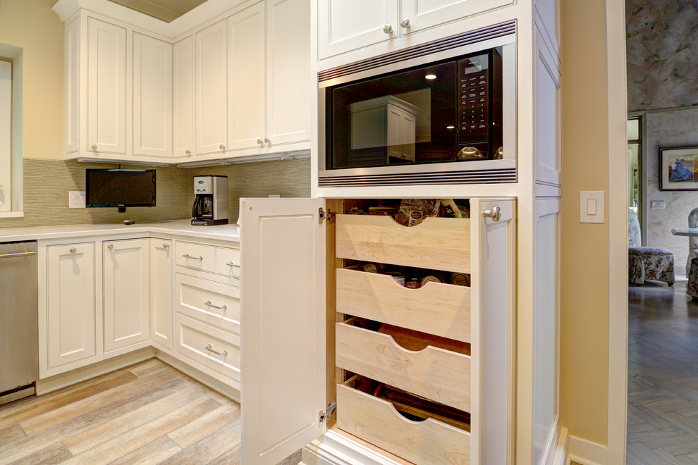 Photo of a large classic kitchen in Chicago with recessed-panel cabinets, white cabinets, marble worktops and an island.