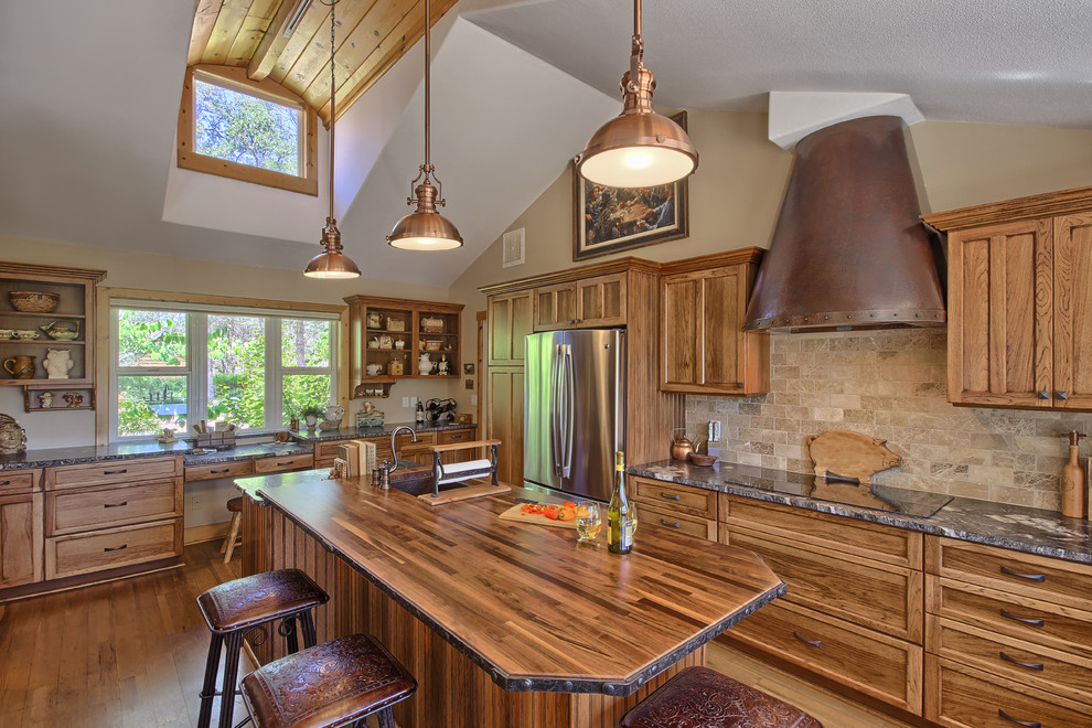 Example of a large country u-shaped medium tone wood floor eat-in kitchen design in Other with a farmhouse sink, recessed-panel cabinets, medium tone wood cabinets, granite countertops, beige backsplash, subway tile backsplash, stainless steel appliances and an island