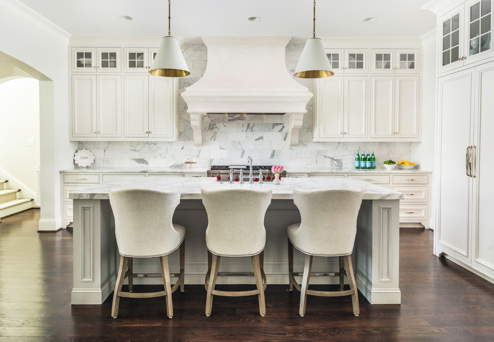 Inspiration for a timeless dark wood floor and brown floor kitchen remodel in Nashville with recessed-panel cabinets, white cabinets, white backsplash, stainless steel appliances, an island and white countertops