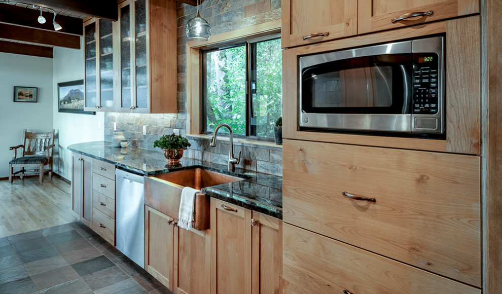 Small mountain style galley slate floor and wood ceiling eat-in kitchen photo in Other with a farmhouse sink, shaker cabinets, light wood cabinets, granite countertops, slate backsplash, stainless steel appliances, no island and blue countertops