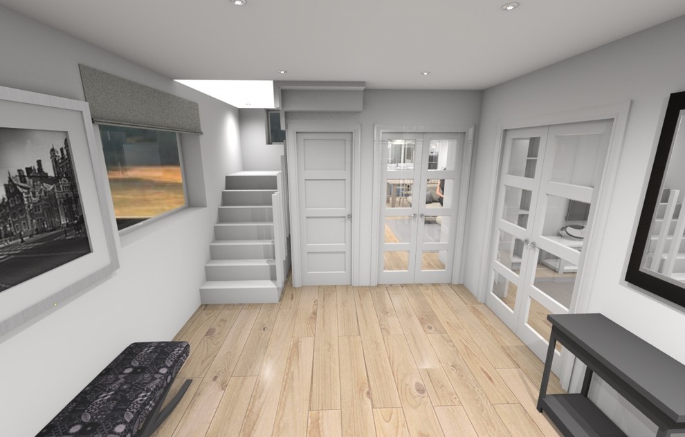 Design ideas for a medium sized beach style galley open plan kitchen in Kent with a submerged sink, shaker cabinets, blue cabinets, composite countertops, stainless steel appliances, medium hardwood flooring, an island and white worktops.