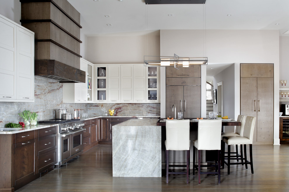 Large trendy l-shaped medium tone wood floor open concept kitchen photo in New York with quartzite countertops, an island, white countertops, an undermount sink, stainless steel appliances, stone slab backsplash, dark wood cabinets, recessed-panel cabinets and multicolored backsplash