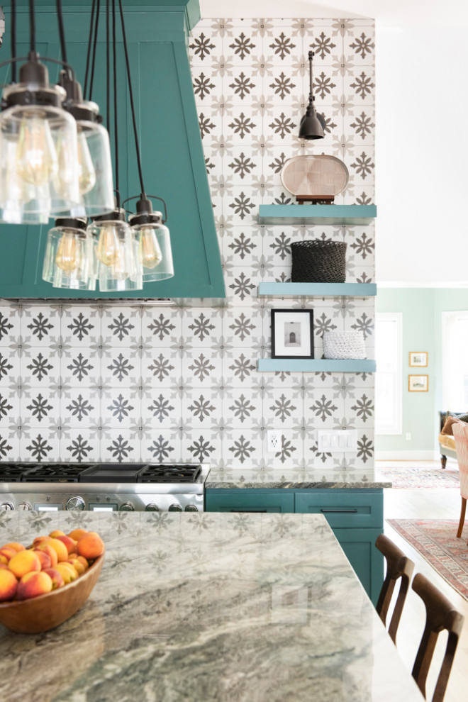 Transitional kitchen photo in Houston with a farmhouse sink, shaker cabinets, green cabinets and an island