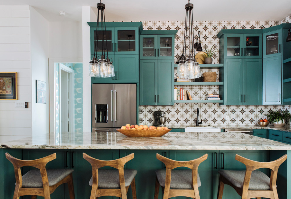 Example of a transitional kitchen design in Houston with a farmhouse sink, shaker cabinets and an island