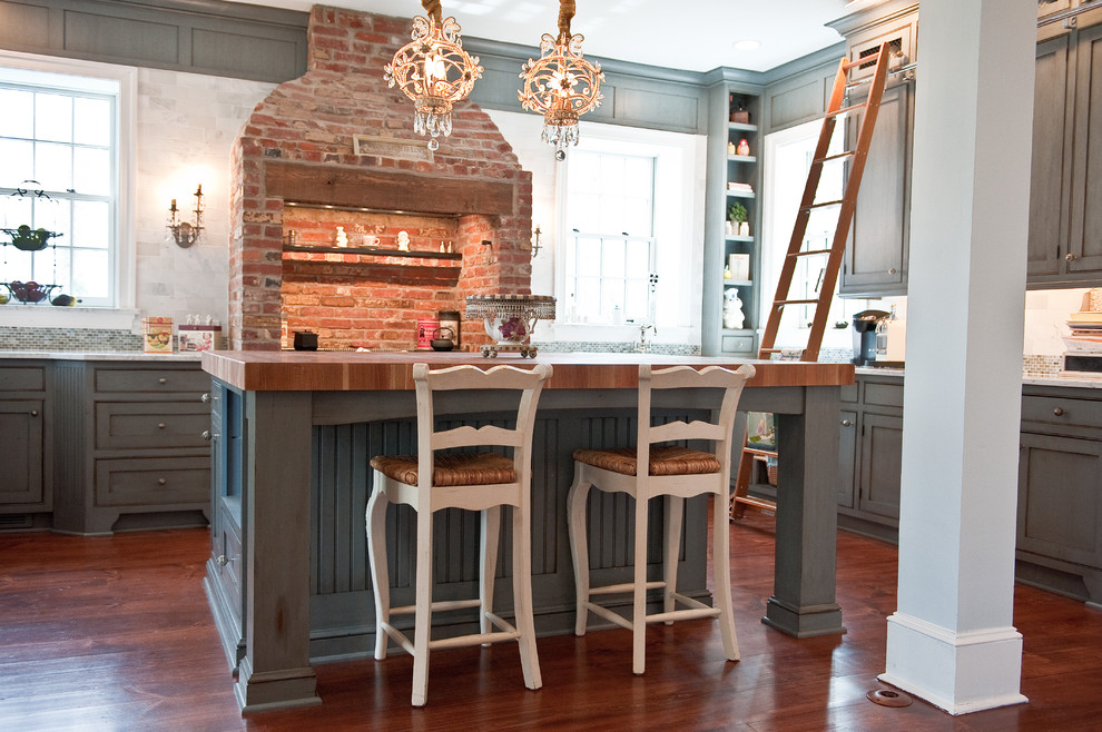 Inspiration for a large timeless u-shaped kitchen remodel in Philadelphia with blue cabinets and wood countertops
