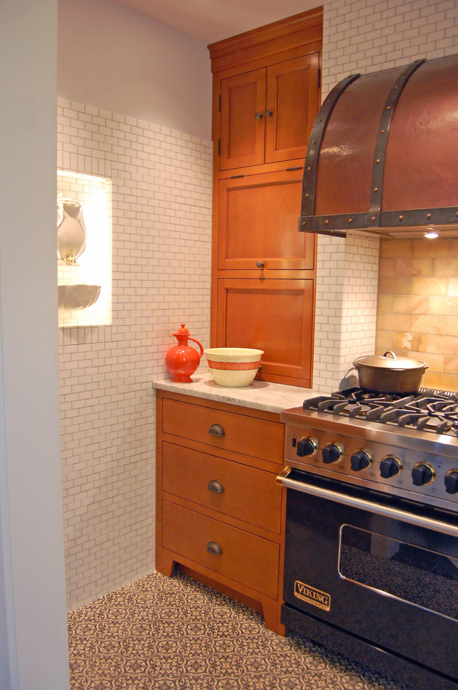 This is an example of a traditional kitchen in Chicago with coloured appliances.