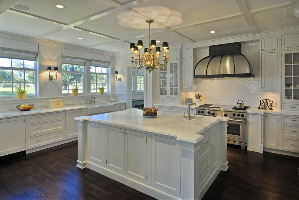 Example of a classic kitchen design in Miami with shaker cabinets, stainless steel appliances, subway tile backsplash, a farmhouse sink, white cabinets, white backsplash and marble countertops