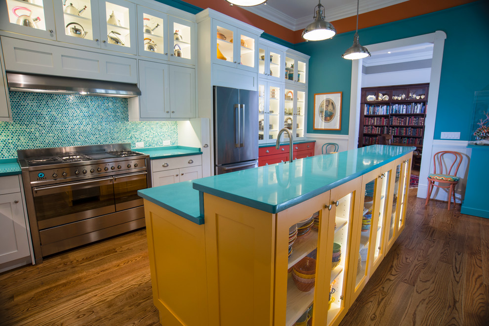 Inspiration for a large world-inspired galley kitchen/diner in Atlanta with a submerged sink, shaker cabinets, red cabinets, engineered stone countertops, blue splashback, mosaic tiled splashback, stainless steel appliances, medium hardwood flooring and a breakfast bar.