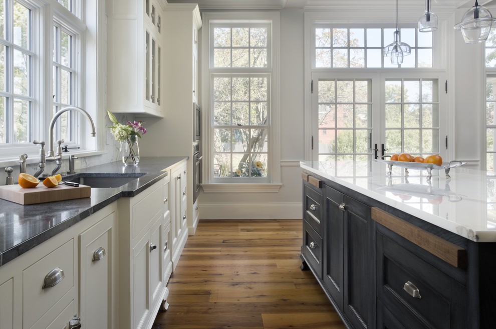 Example of a classic kitchen design in Boston with soapstone countertops