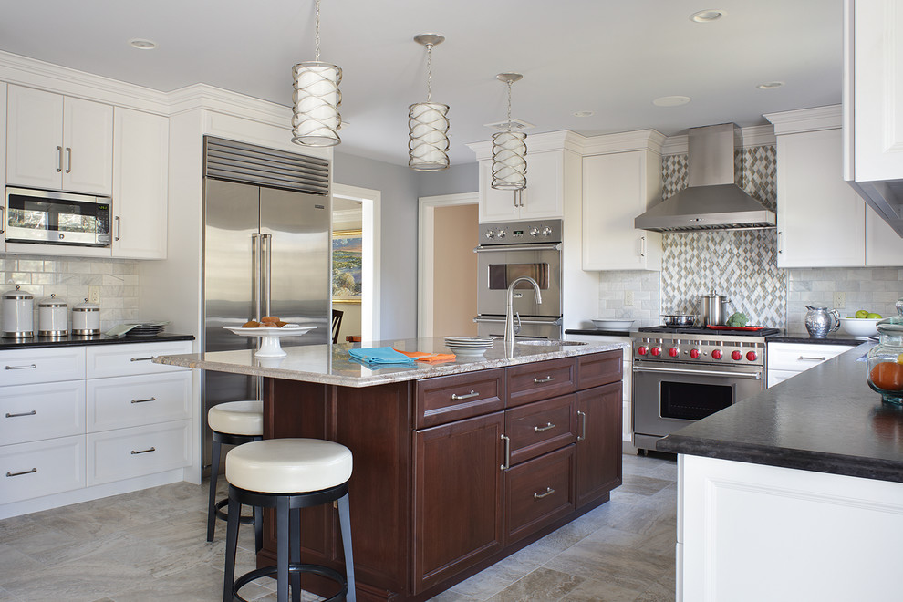 Example of a large transitional l-shaped eat-in kitchen design in New York with an undermount sink, recessed-panel cabinets, white cabinets, granite countertops, gray backsplash, subway tile backsplash, stainless steel appliances and an island