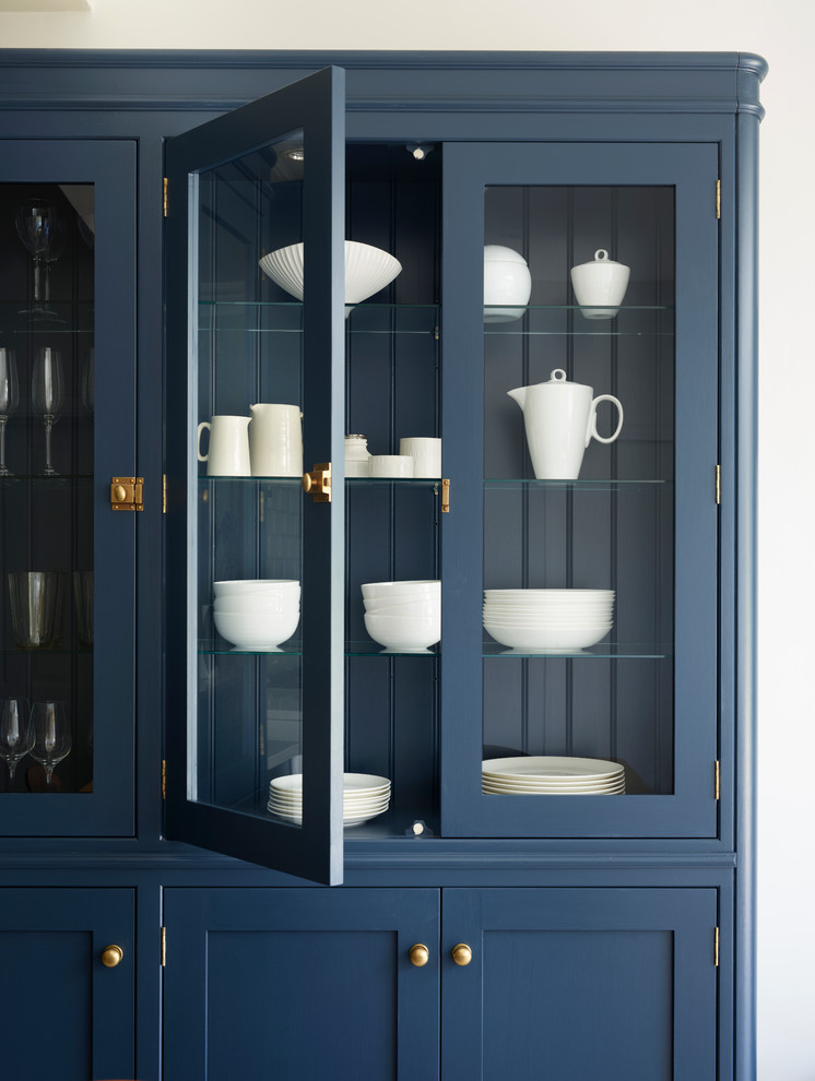 Inspiration for a mid-sized transitional kitchen remodel in Sussex with a farmhouse sink, white backsplash, subway tile backsplash, stainless steel appliances and an island