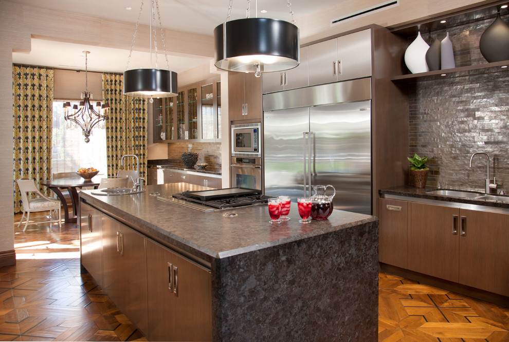 This is an example of a contemporary kitchen in San Diego with stainless steel appliances.