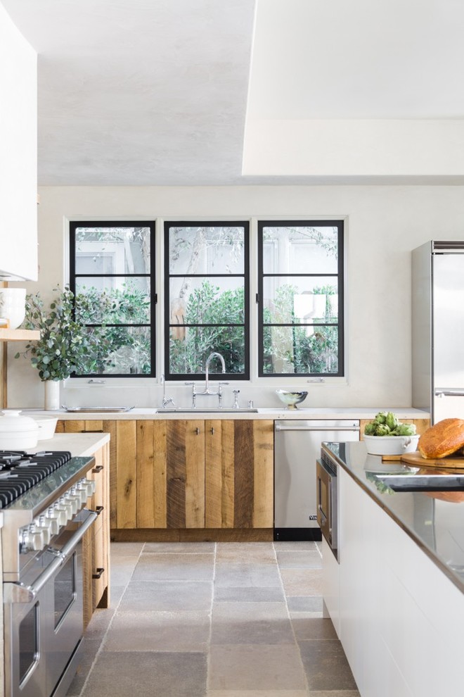 This is an example of a contemporary kitchen in Los Angeles with stainless steel appliances.