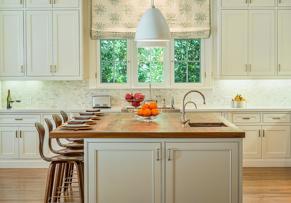 Inspiration for a classic kitchen in Los Angeles with a belfast sink, beaded cabinets, beige cabinets, wood worktops, multi-coloured splashback, mosaic tiled splashback and brown worktops.