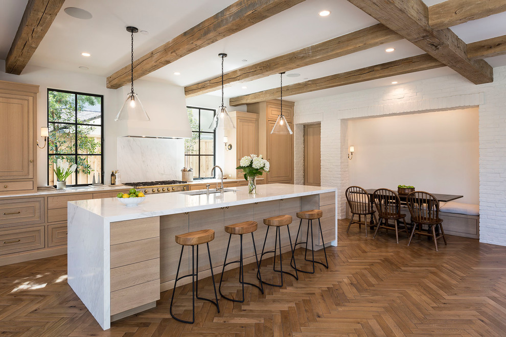 Inspiration for a transitional medium tone wood floor and brown floor eat-in kitchen remodel in Boise with an undermount sink, beaded inset cabinets, light wood cabinets, white backsplash and an island