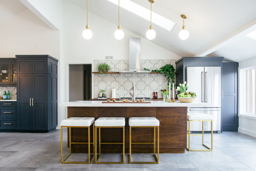Design ideas for a traditional kitchen in Other with shaker cabinets, black cabinets, multi-coloured splashback, stainless steel appliances, an island, grey floors, white worktops and cement tile splashback.