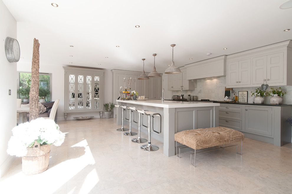 This is an example of a traditional grey and white kitchen in Surrey.