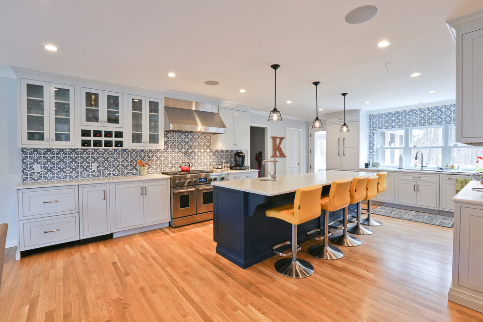 Large 1950s galley light wood floor open concept kitchen photo in DC Metro with a drop-in sink, beaded inset cabinets, gray cabinets, quartz countertops, blue backsplash, porcelain backsplash, paneled appliances, an island and gray countertops