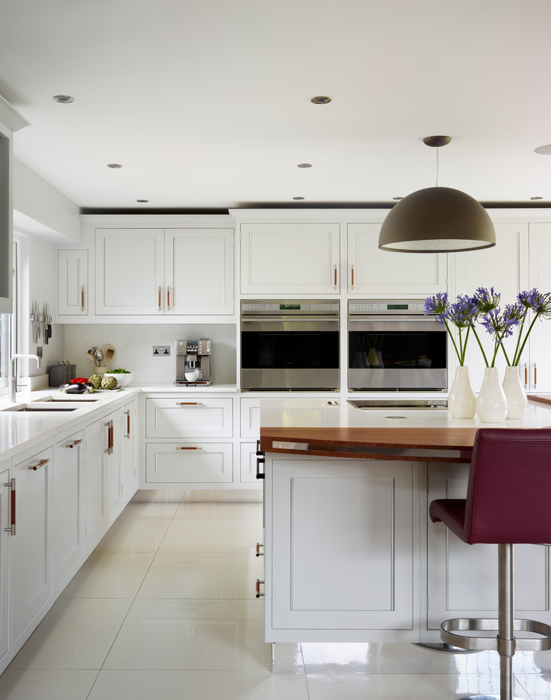This is an example of a medium sized classic kitchen in Hertfordshire.
