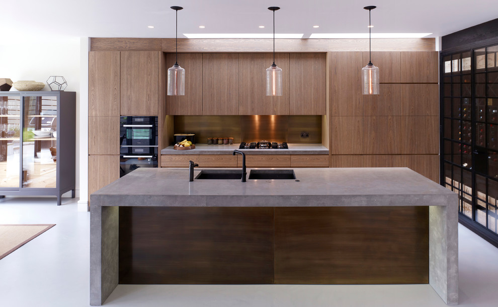 Design ideas for a contemporary galley kitchen in London with flat-panel cabinets and dark wood cabinets.