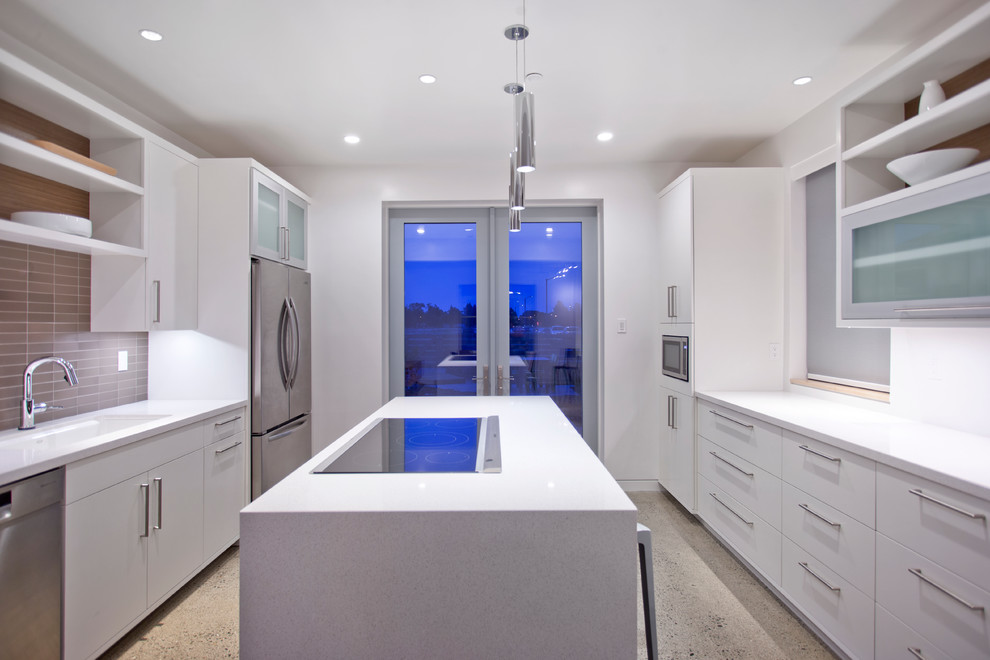 Eat-in kitchen - large contemporary u-shaped concrete floor and gray floor eat-in kitchen idea in Sacramento with an undermount sink, flat-panel cabinets, white cabinets, quartz countertops, brown backsplash, ceramic backsplash, stainless steel appliances and an island