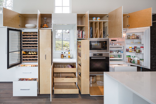 Wine and Dine: White Flat Panel Cabinets with a Hidden Wine Cellar