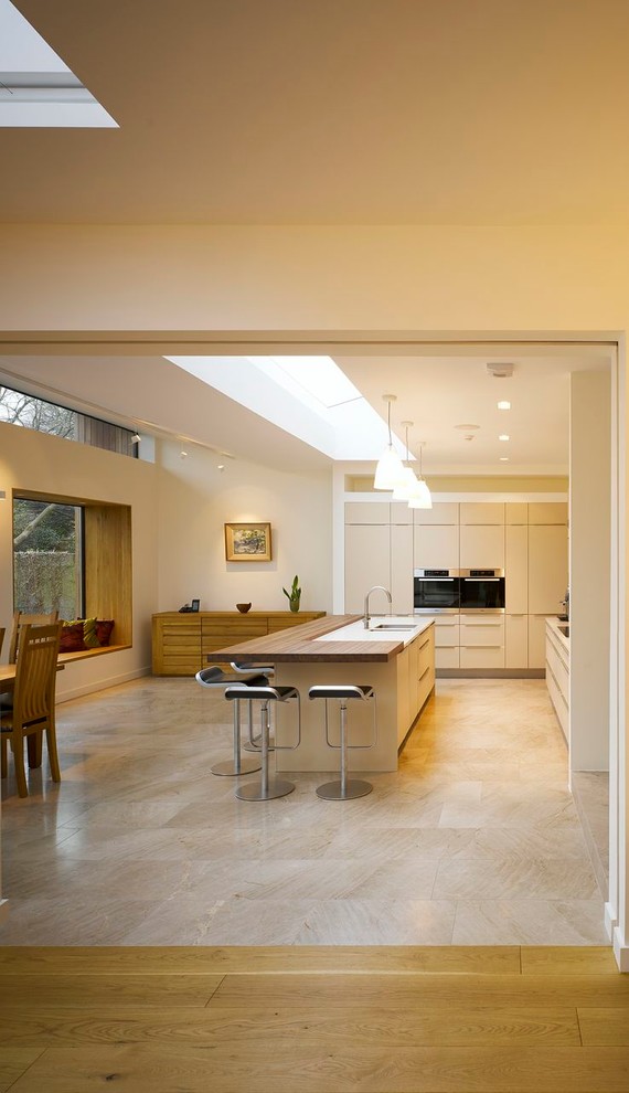 Modern kitchen in Dublin with flat-panel cabinets.