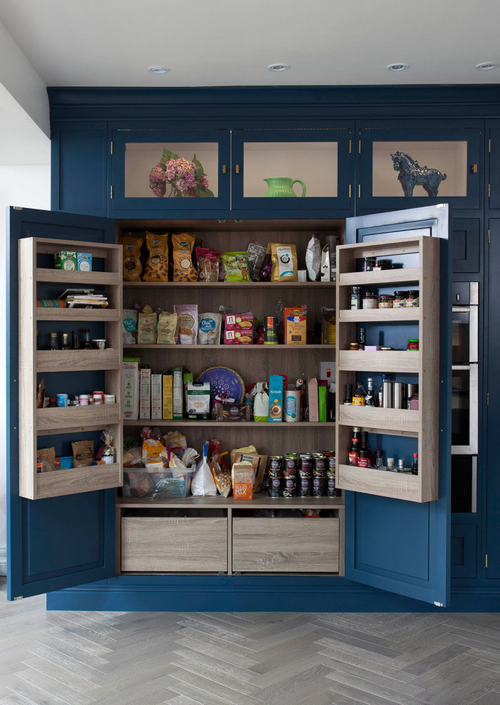 Contemporary kitchen in Dublin with shaker cabinets and blue cabinets.