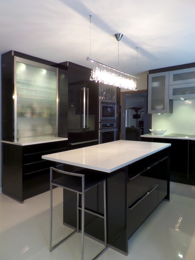 Design ideas for a small contemporary l-shaped kitchen/diner in Other with a submerged sink, flat-panel cabinets, black cabinets, engineered stone countertops, white splashback, stone slab splashback, black appliances, porcelain flooring and an island.