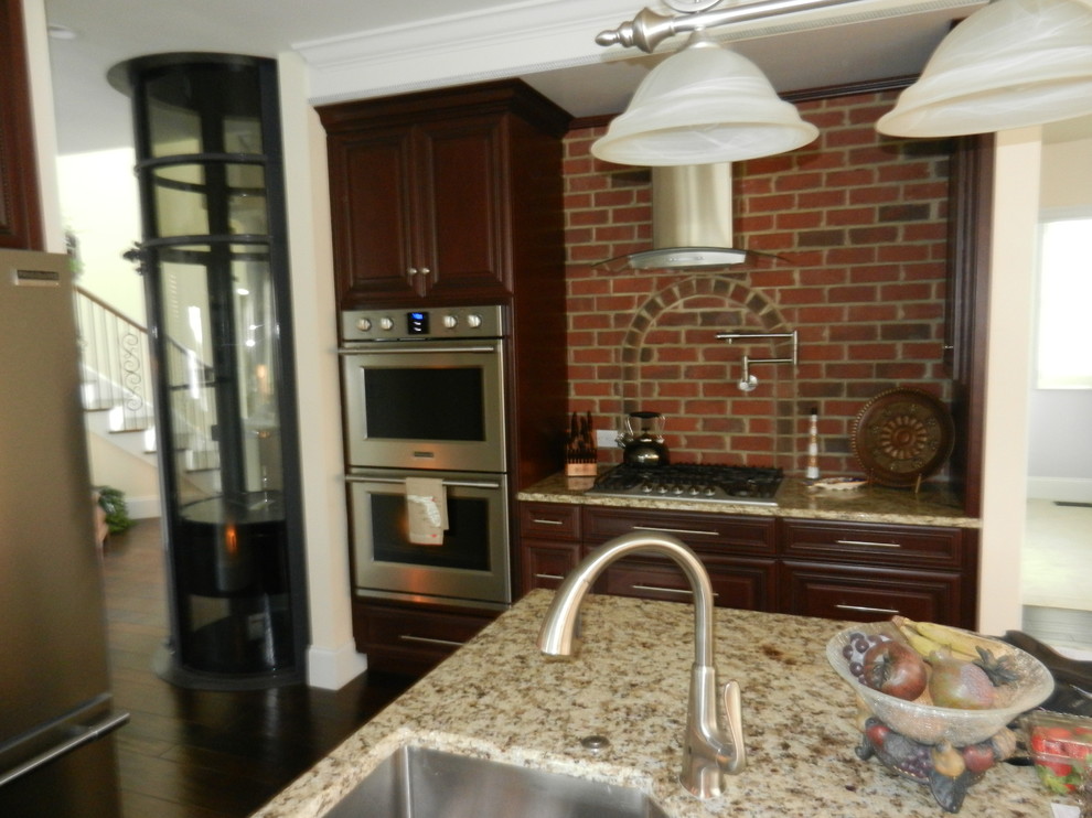 Photo of a medium sized classic u-shaped kitchen/diner in Charleston with an island.