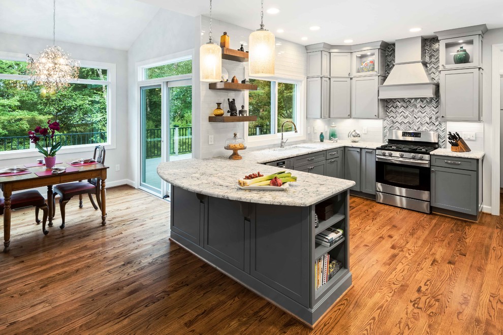 Mid-sized transitional u-shaped medium tone wood floor and brown floor eat-in kitchen photo in Raleigh with a single-bowl sink, shaker cabinets, gray cabinets, granite countertops, white backsplash, porcelain backsplash, stainless steel appliances, a peninsula and white countertops