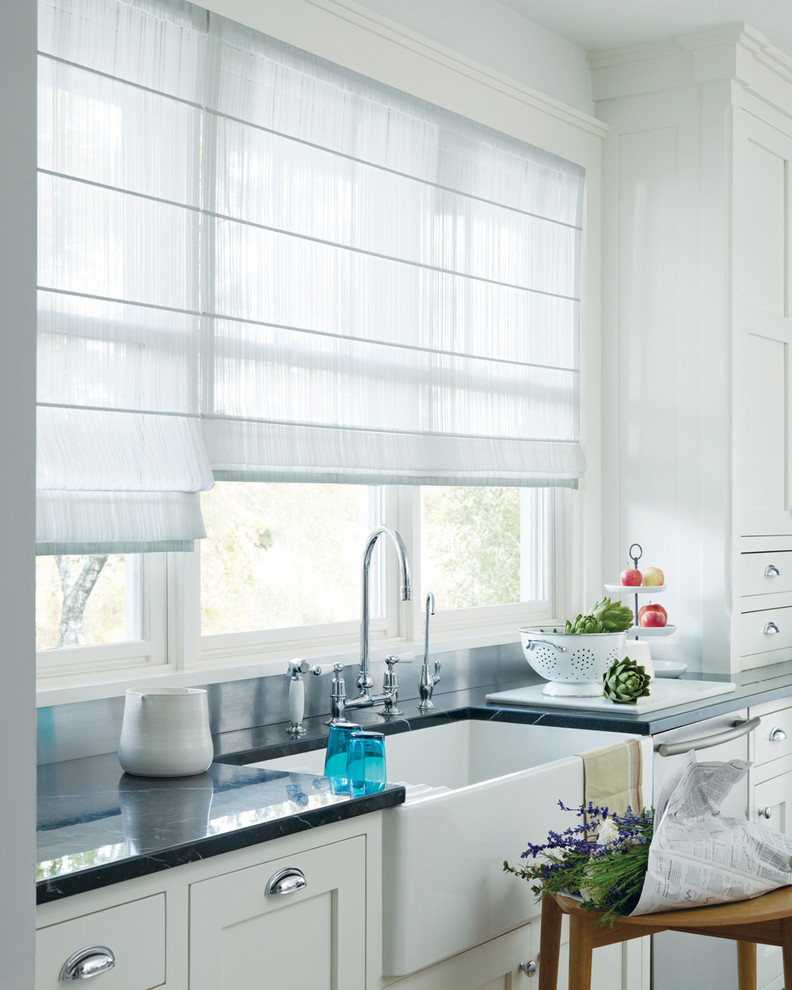 Example of a single-wall kitchen design in Other with a farmhouse sink, recessed-panel cabinets, white cabinets, marble countertops, gray backsplash, stone slab backsplash and stainless steel appliances