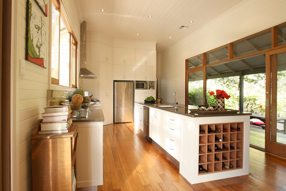 Inspiration for a transitional kitchen remodel in Sydney with an undermount sink, shaker cabinets, white cabinets and stainless steel appliances