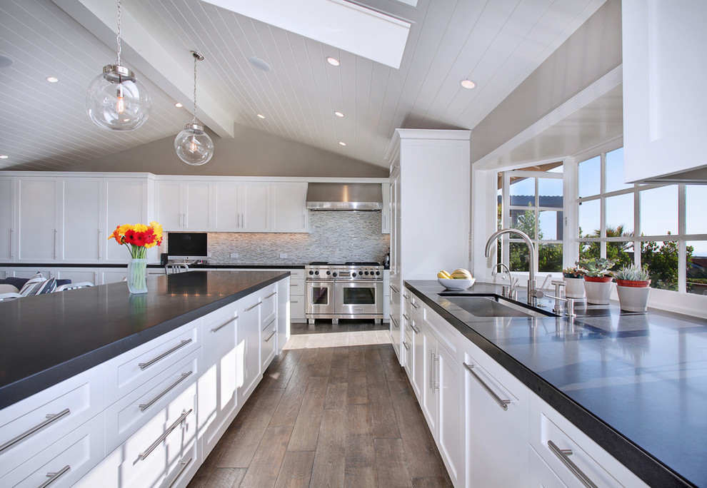 Traditional grey and cream kitchen in Orange County with stainless steel appliances.