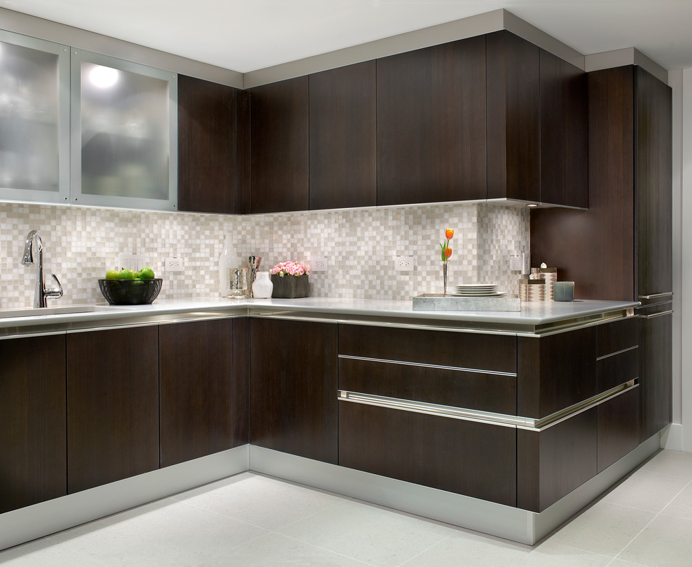 Photo of a contemporary u-shaped kitchen/diner in Chicago with flat-panel cabinets, dark wood cabinets, white splashback, stainless steel appliances, an island, a submerged sink and ceramic splashback.