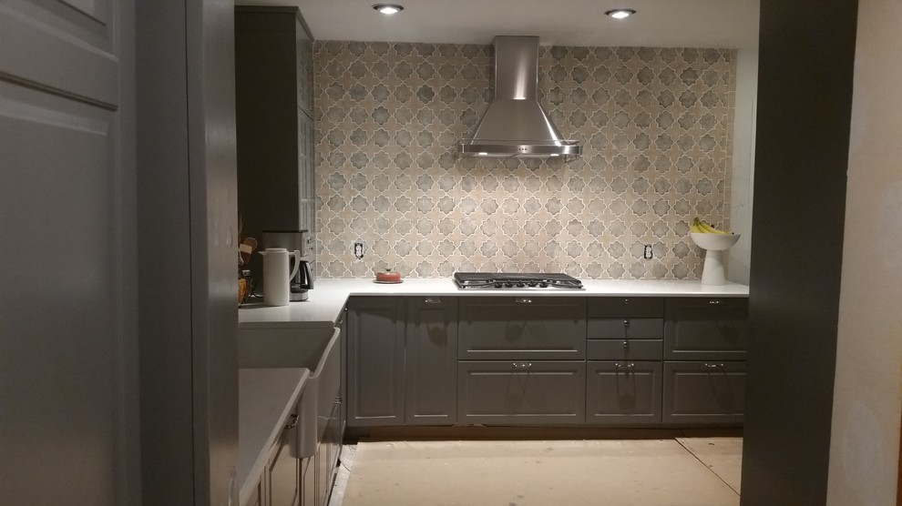 Inspiration for a medium sized classic l-shaped enclosed kitchen in Austin with a belfast sink, raised-panel cabinets, grey cabinets, quartz worktops, multi-coloured splashback, ceramic splashback, stainless steel appliances, terracotta flooring, no island and brown floors.