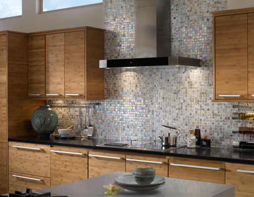 Large modern single-wall kitchen in Los Angeles with flat-panel cabinets, light wood cabinets, granite worktops, multi-coloured splashback, mosaic tiled splashback and an island.