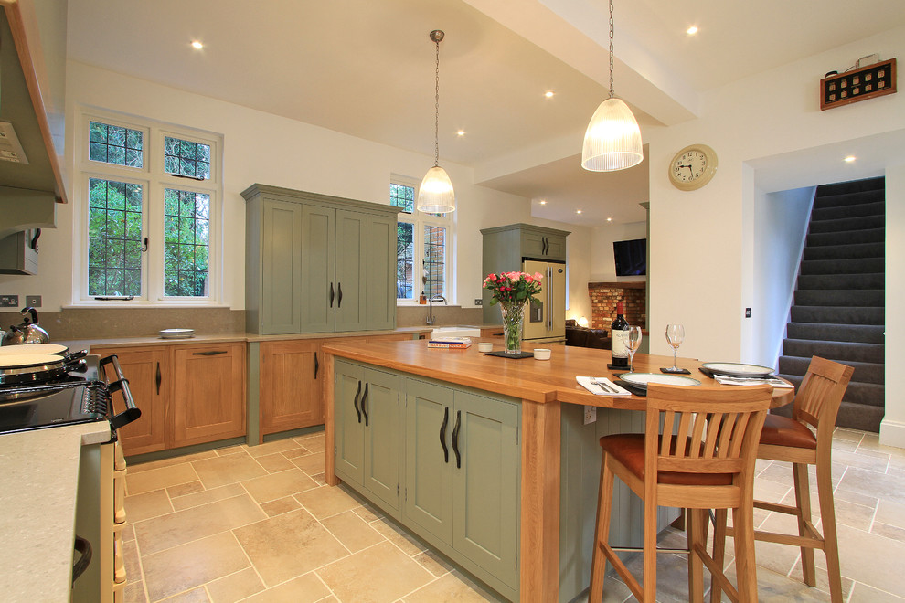 Design ideas for a classic l-shaped kitchen/diner in Hampshire with a double-bowl sink, shaker cabinets, light wood cabinets, engineered stone countertops, stone slab splashback and coloured appliances.