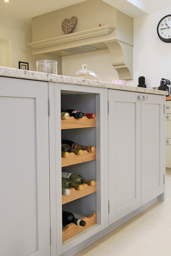 Inspiration for a large traditional l-shaped kitchen/diner in Hampshire with a belfast sink, shaker cabinets, grey cabinets, granite worktops, ceramic splashback, coloured appliances, porcelain flooring and an island.