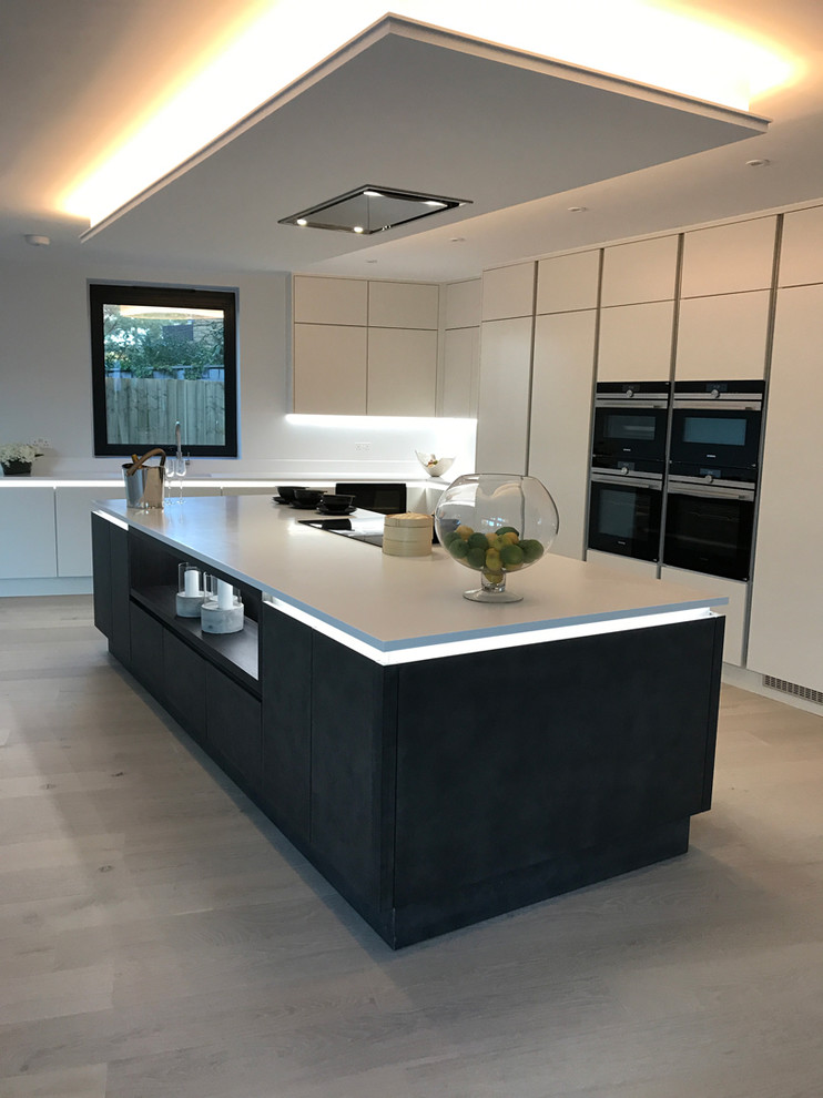Photo of a contemporary kitchen in Dorset with composite countertops.