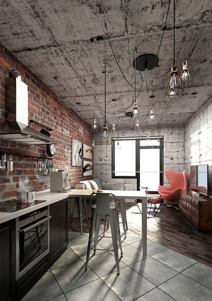 Foto på ett litet industriellt vit linjärt kök och matrum, med en undermonterad diskho, luckor med infälld panel, svarta skåp, bänkskiva i kvarts, brunt stänkskydd, stänkskydd i tegel, rostfria vitvaror, cementgolv, en halv köksö och grått golv