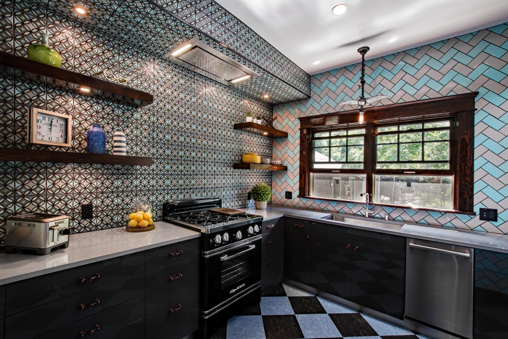 Inspiration for a small industrial l-shaped linoleum floor and multicolored floor enclosed kitchen remodel in Los Angeles with quartz countertops, multicolored backsplash, subway tile backsplash, no island, gray countertops, an undermount sink, flat-panel cabinets, black cabinets and black appliances