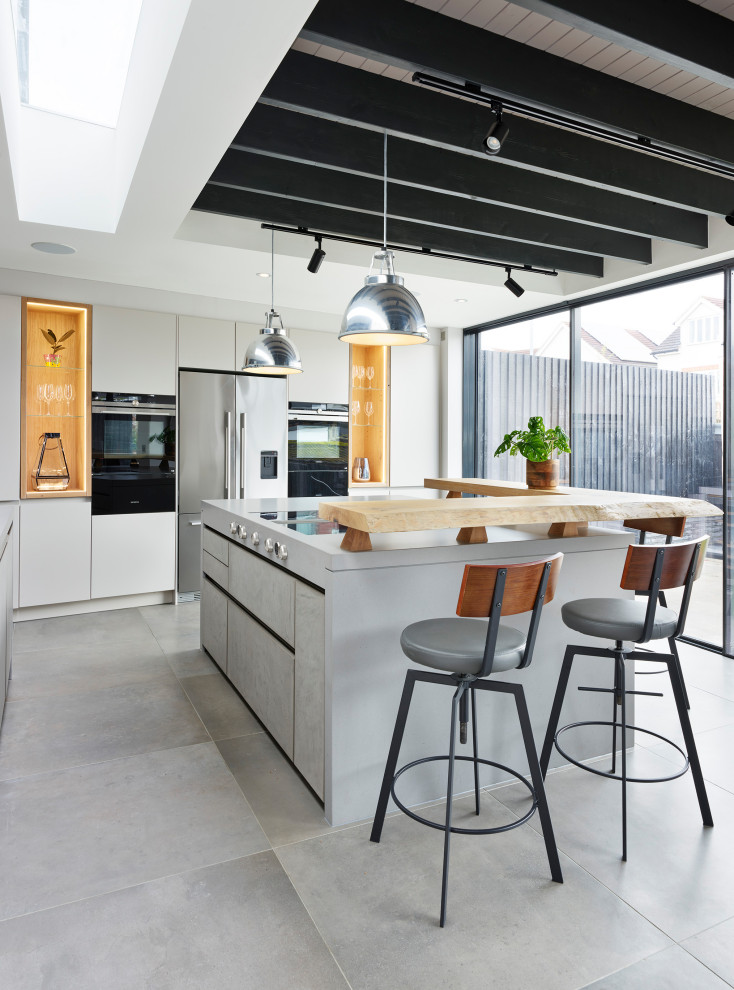 Photo of an industrial kitchen in London with an island.