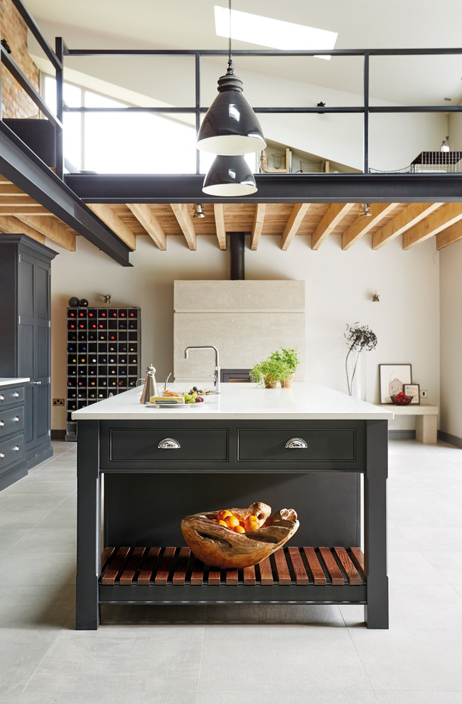 Inspiration for a large industrial open concept kitchen remodel in Manchester with shaker cabinets, an island and gray cabinets