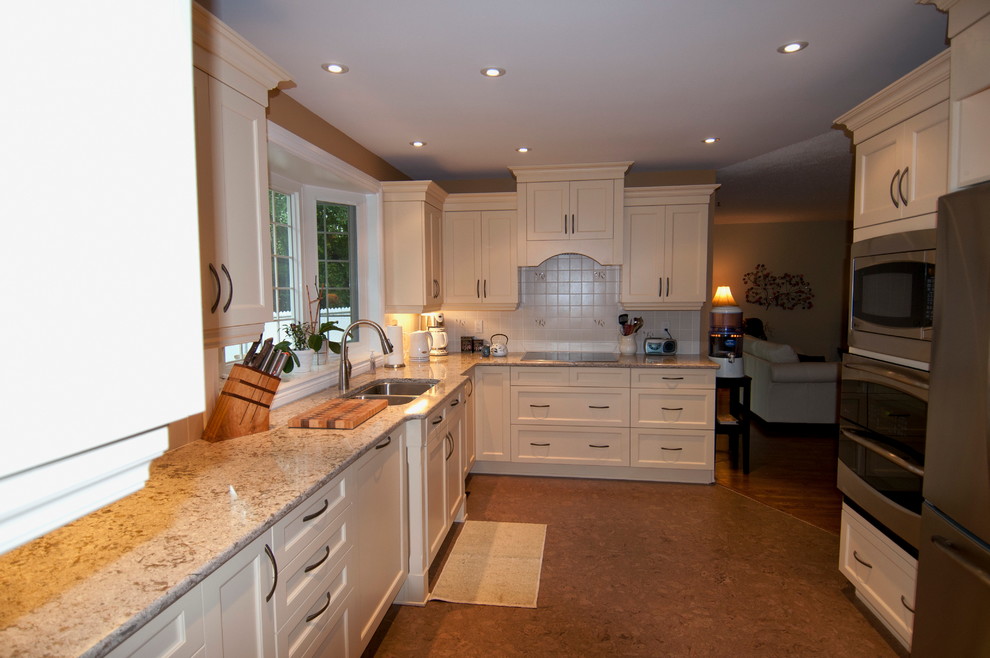 Example of a mid-sized classic l-shaped cork floor eat-in kitchen design in Ottawa with an undermount sink, beige cabinets, quartz countertops, white backsplash, ceramic backsplash, stainless steel appliances, shaker cabinets and no island