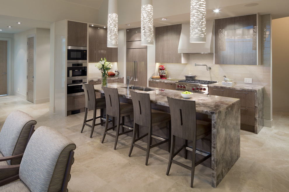 Design ideas for a medium sized contemporary l-shaped kitchen/diner in Calgary with a submerged sink, flat-panel cabinets, grey cabinets, beige splashback, stainless steel appliances, an island, onyx worktops, travertine flooring, beige floors and brown worktops.