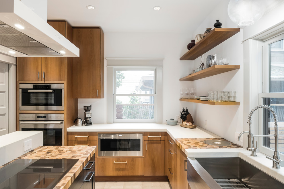 Mid-century modern kitchen photo in Portland