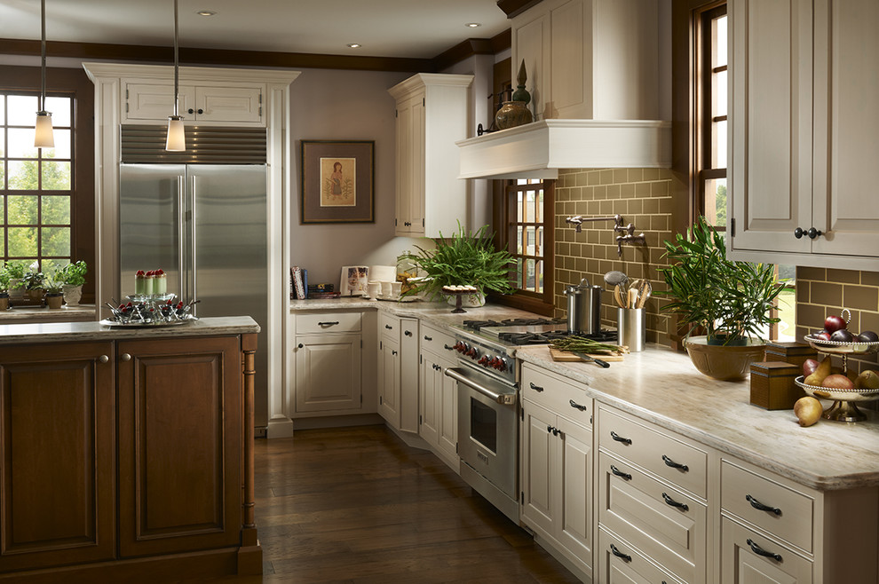 Inspiration for a huge timeless single-wall dark wood floor and brown floor open concept kitchen remodel in Houston with raised-panel cabinets, white cabinets, quartz countertops, brown backsplash, stainless steel appliances, an undermount sink, porcelain backsplash and an island