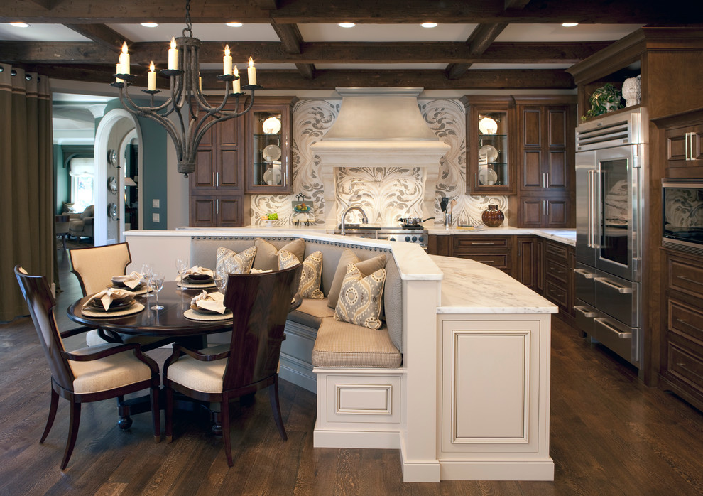 Inspiration for a large timeless l-shaped dark wood floor eat-in kitchen remodel in Atlanta with stainless steel appliances, marble countertops, raised-panel cabinets, dark wood cabinets, an island and white countertops
