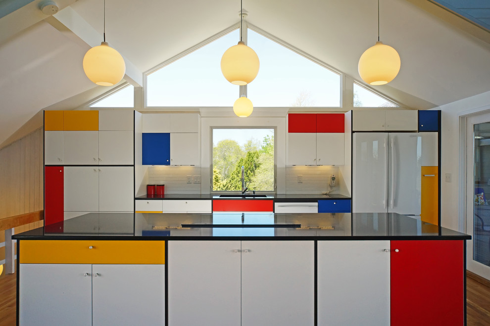 Example of a mid-century modern galley medium tone wood floor kitchen design in Boston with flat-panel cabinets, white backsplash, subway tile backsplash, white appliances and an island